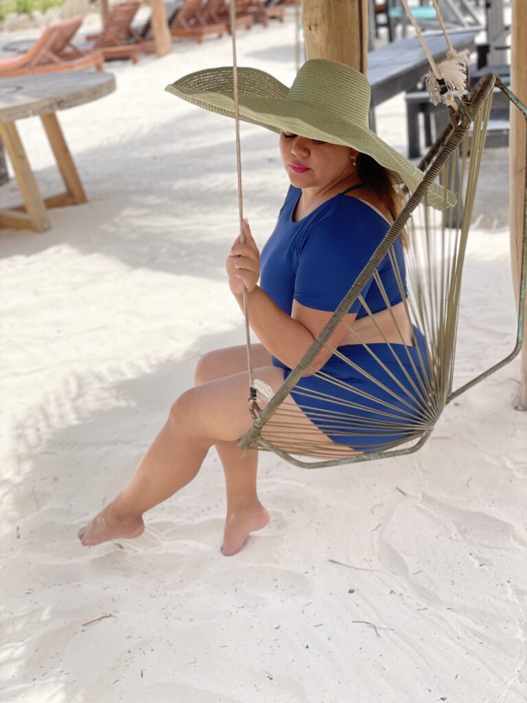 Zoraida During Her Weight Loss Journey - 2021 - Sitting in a swing on the beach